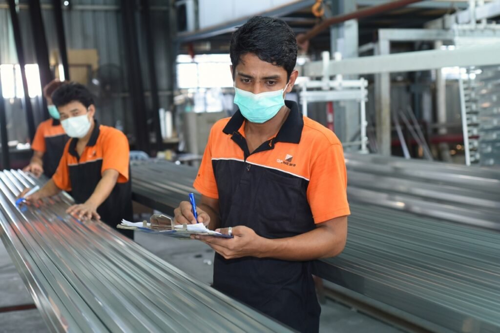 Man working at aluminium product workshop